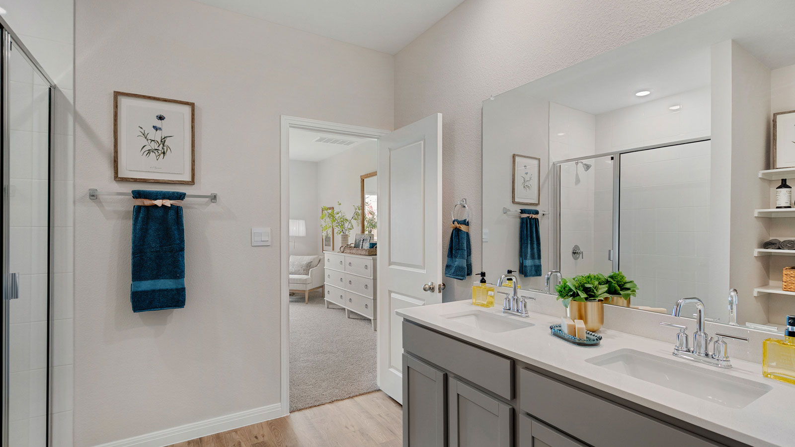 Bathroom with dual sinks and a wide mirror.