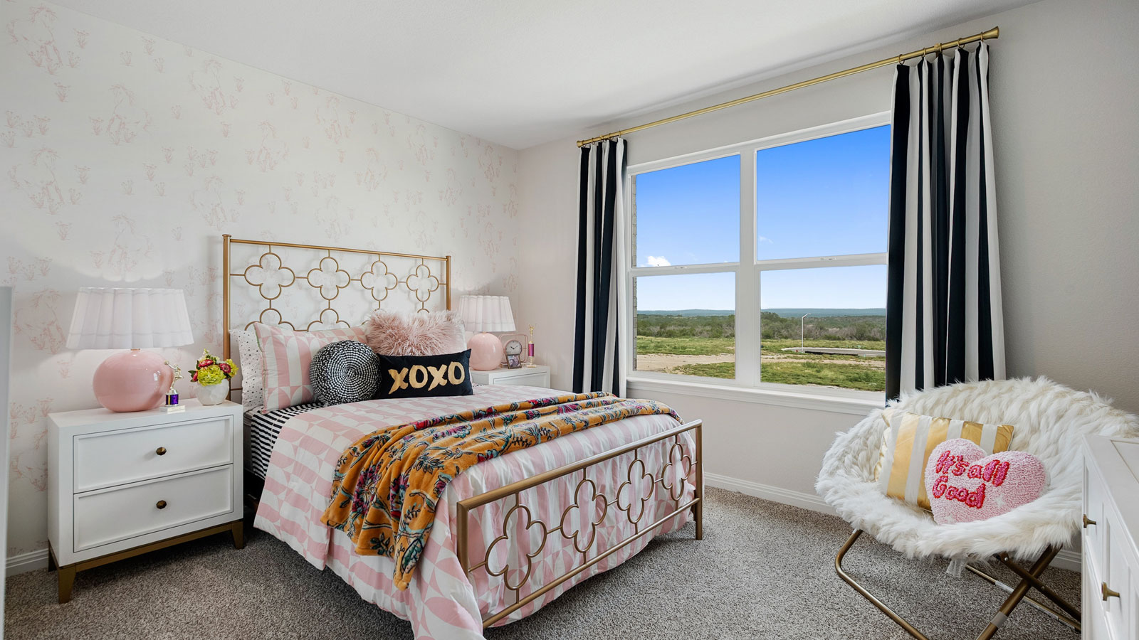 Bedroom with neutral walls, furnishings, and a window.