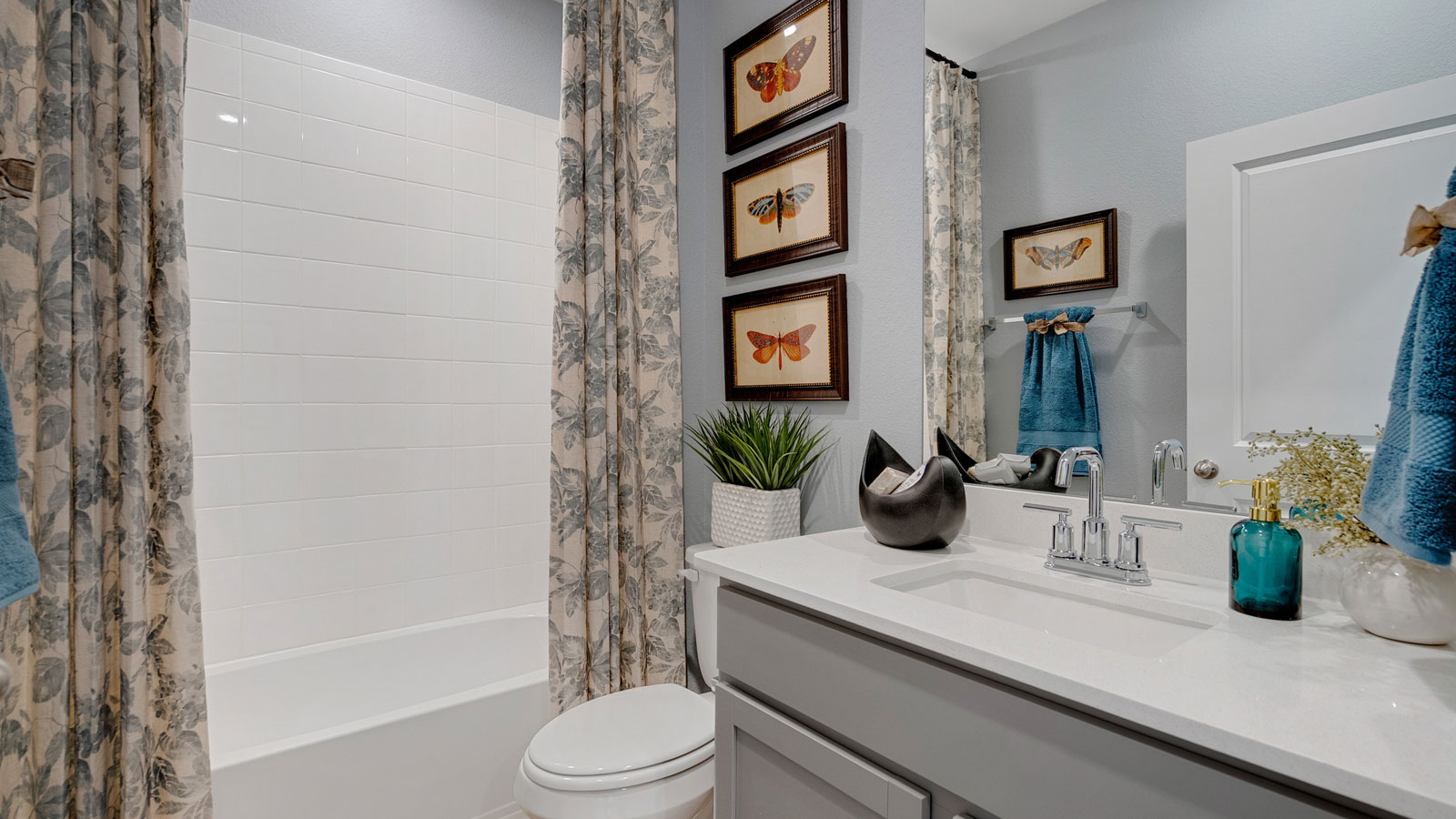 Bathroom featuring a sink, toilet, and shower tub.