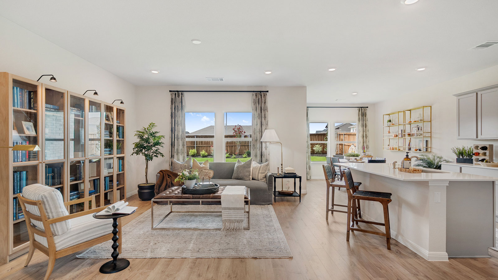 Open concept living space with natural light and simple furnishings.