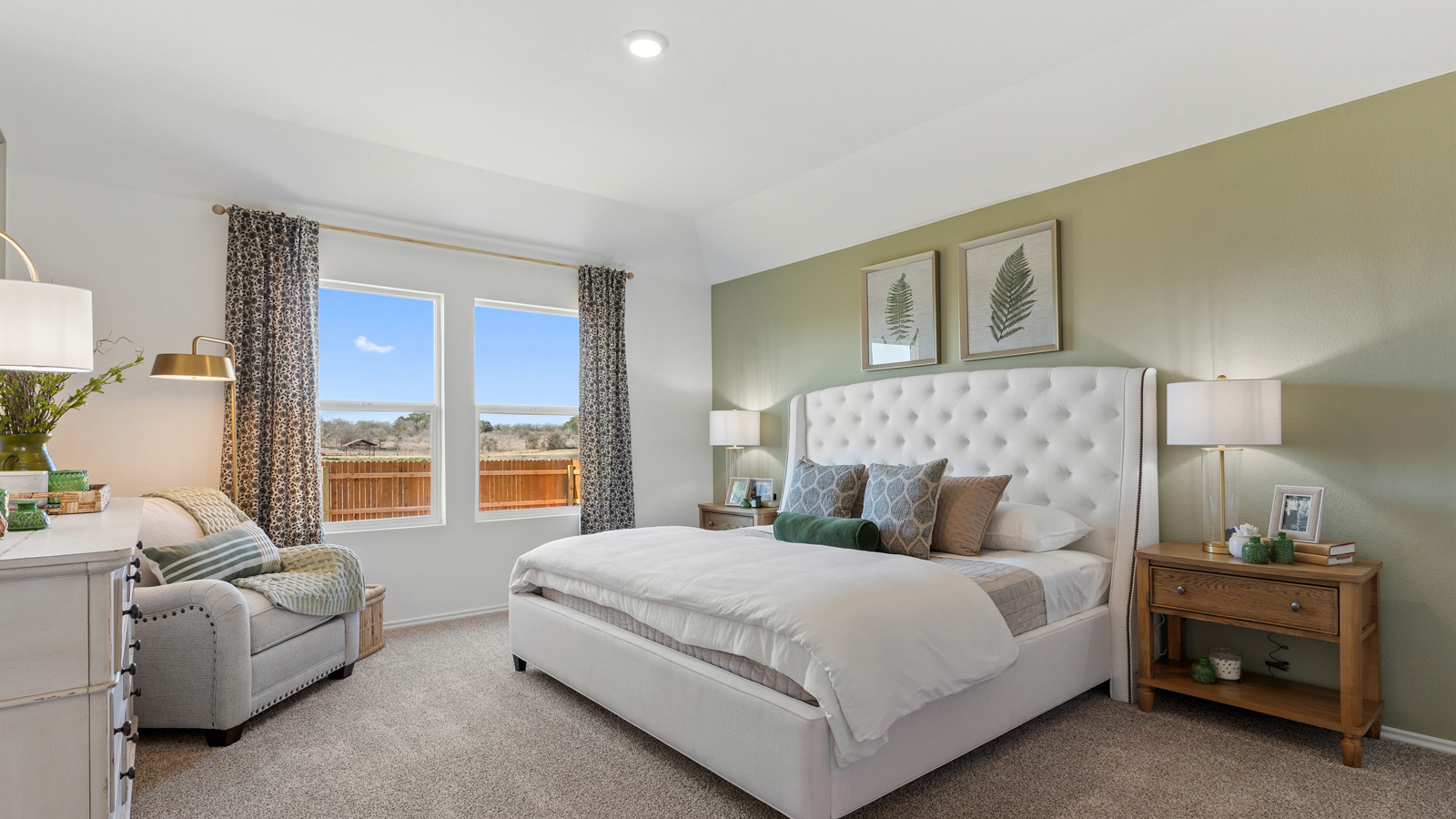 Bedroom 1 with carpeted floors and two large windows.