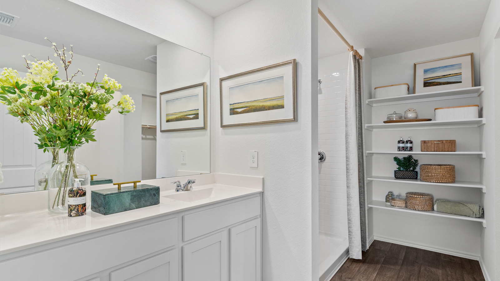 Bathroom 1 with single vanity sink and walk-in shower.