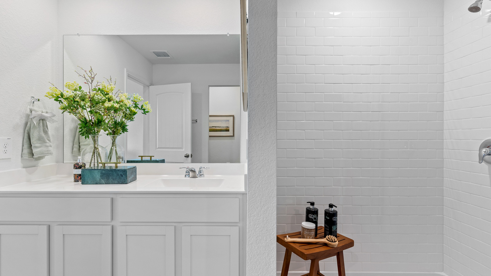 Bathroom 1 with single vanity sink and walk-in shower.