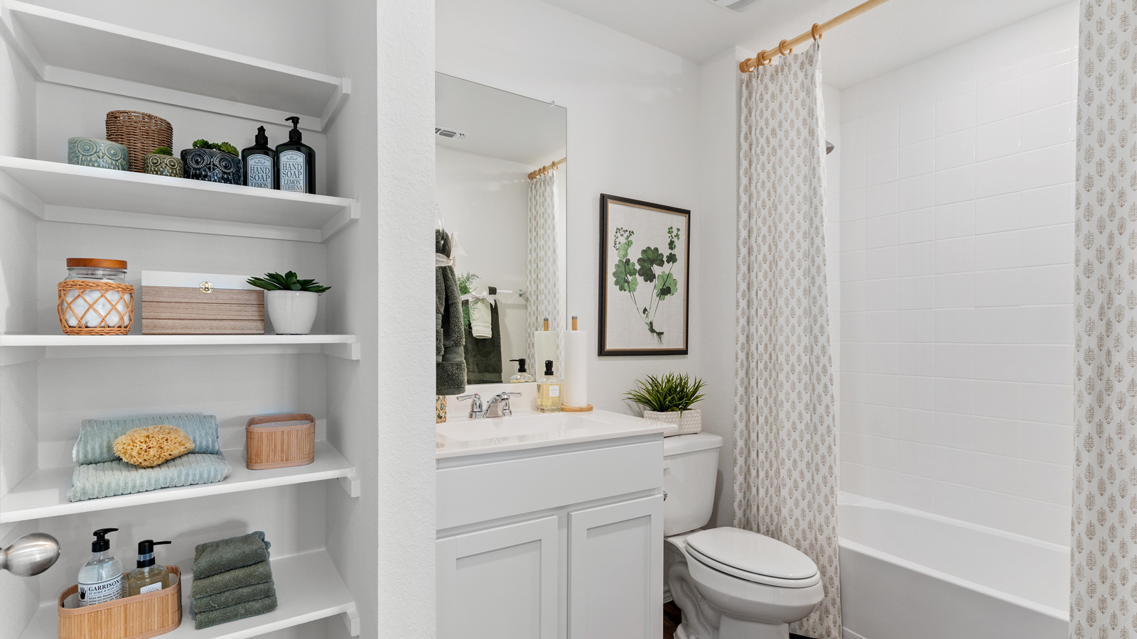 Bathroom 2 with tub and single vanity sink.