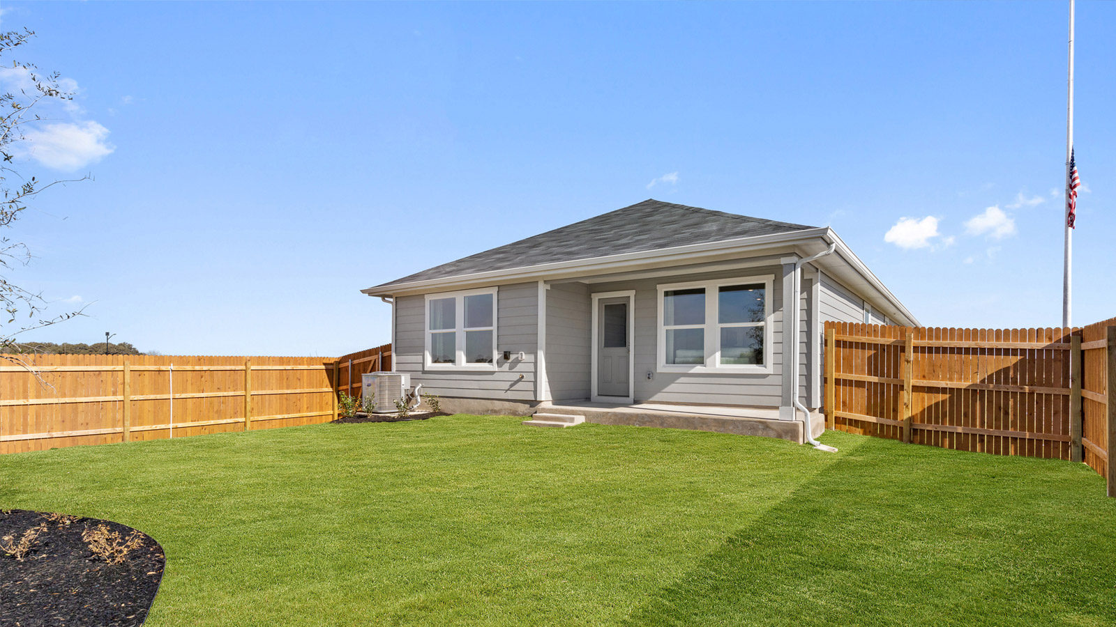 Back exterior of the Caroline floorplan - B elevation at Watermill in Uhland, TX.