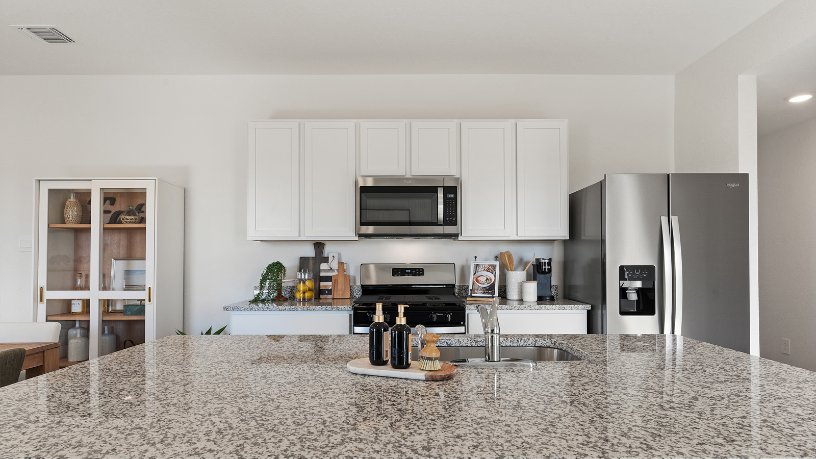 Gourmet kitchen with granite countertops and stainless steel appliances.