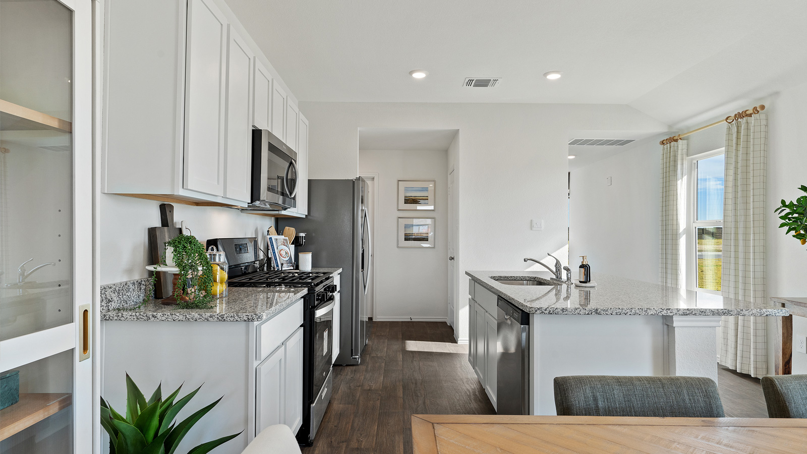 Gourmet kitchen with granite countertops and stainless steel appliances.