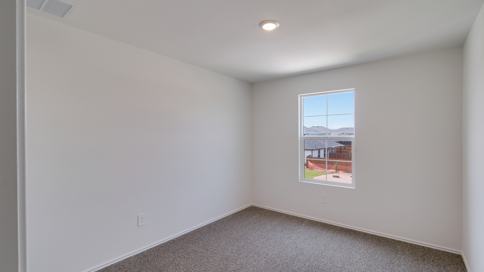 Bedroom 2 with carpeted floors and closet.