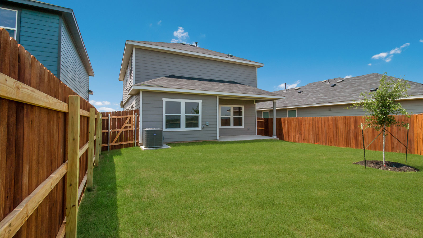 Back exterior of 277 Ebbsfleet Drive with covered back patio.