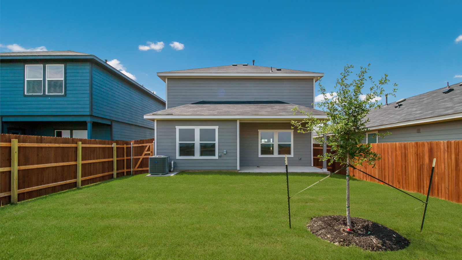 Back exterior of 277 Ebbsfleet Drive with covered back patio.