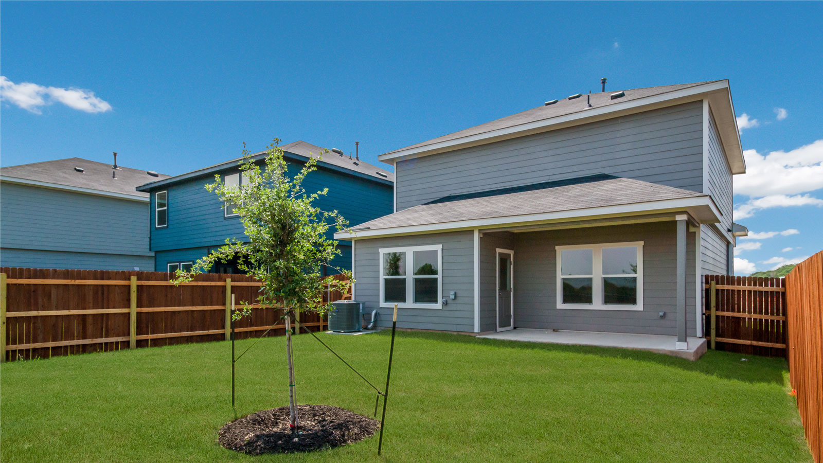 Back exterior of 277 Ebbsfleet Drive with covered back patio.