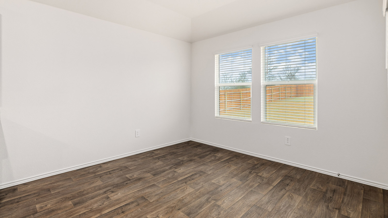 Dining area with window and view of backyard.