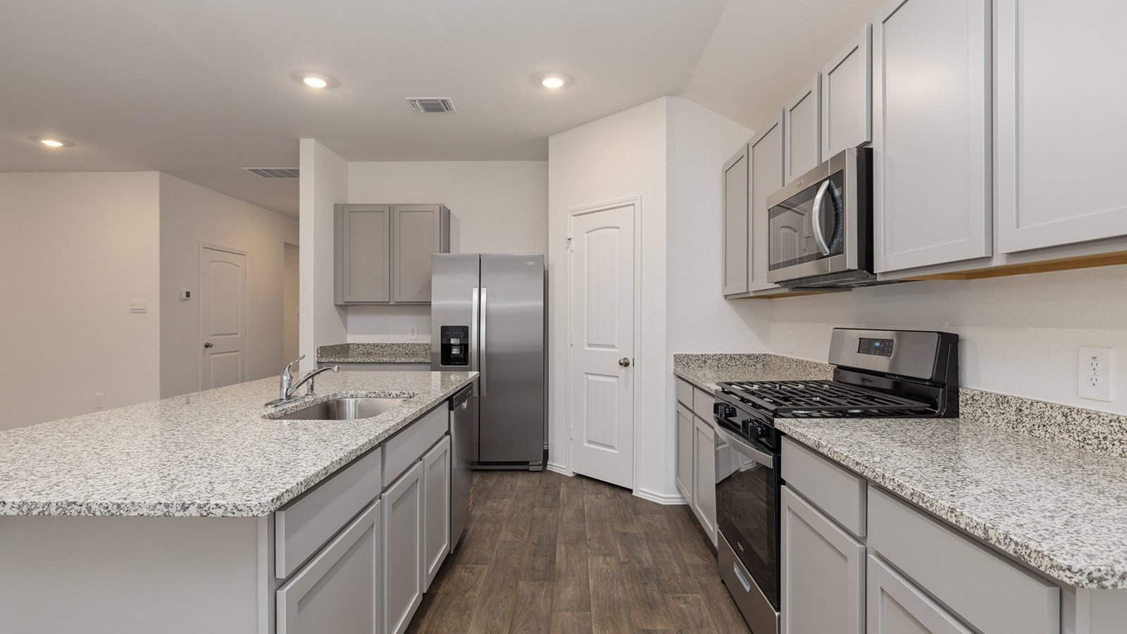 Kitchen with granite countertops.