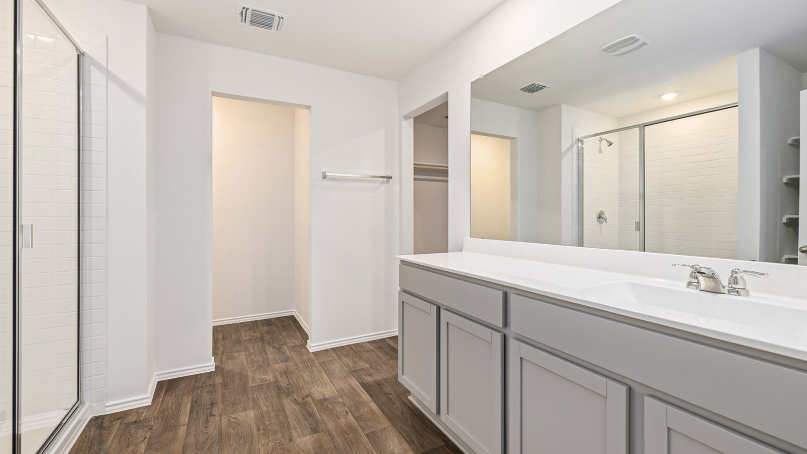 Primary bathroom with walk-in shower.