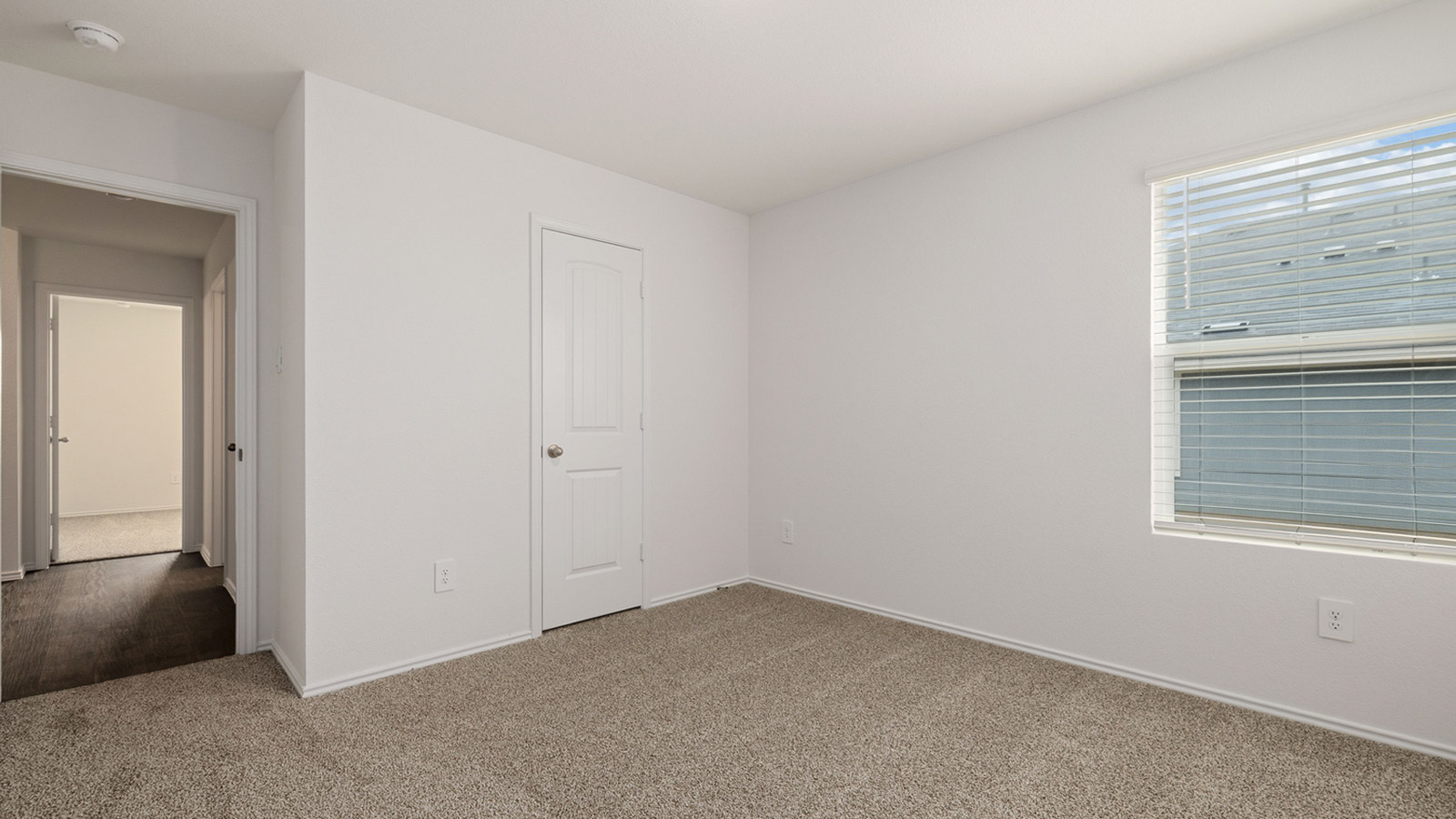 Bedroom 3 with carpeted flooring.
