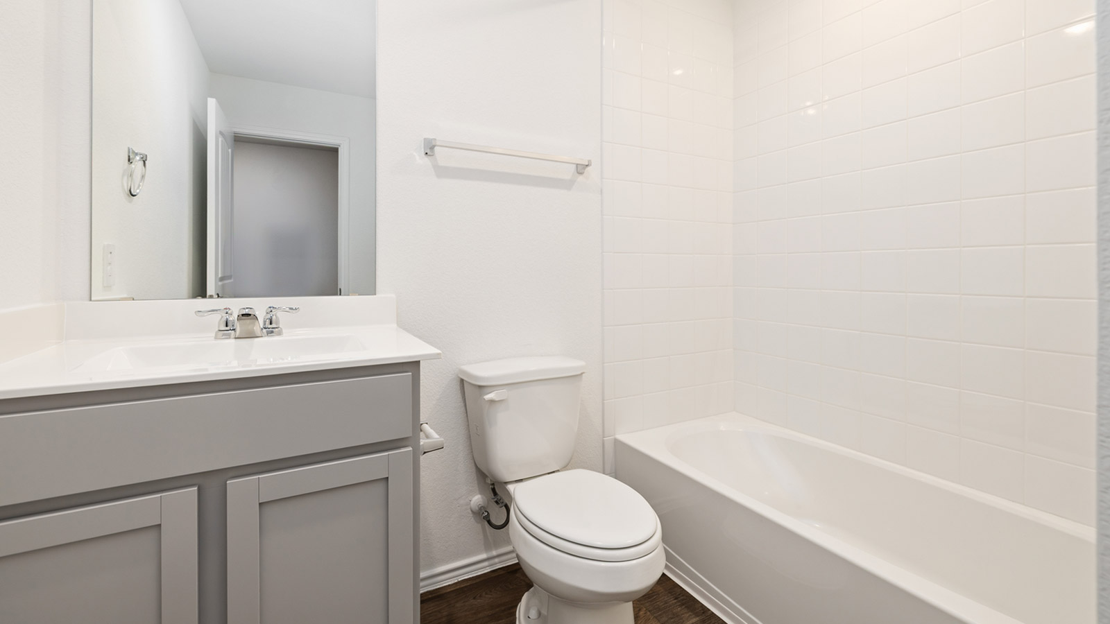 Bathroom 3 with bathtub and raised shower head.