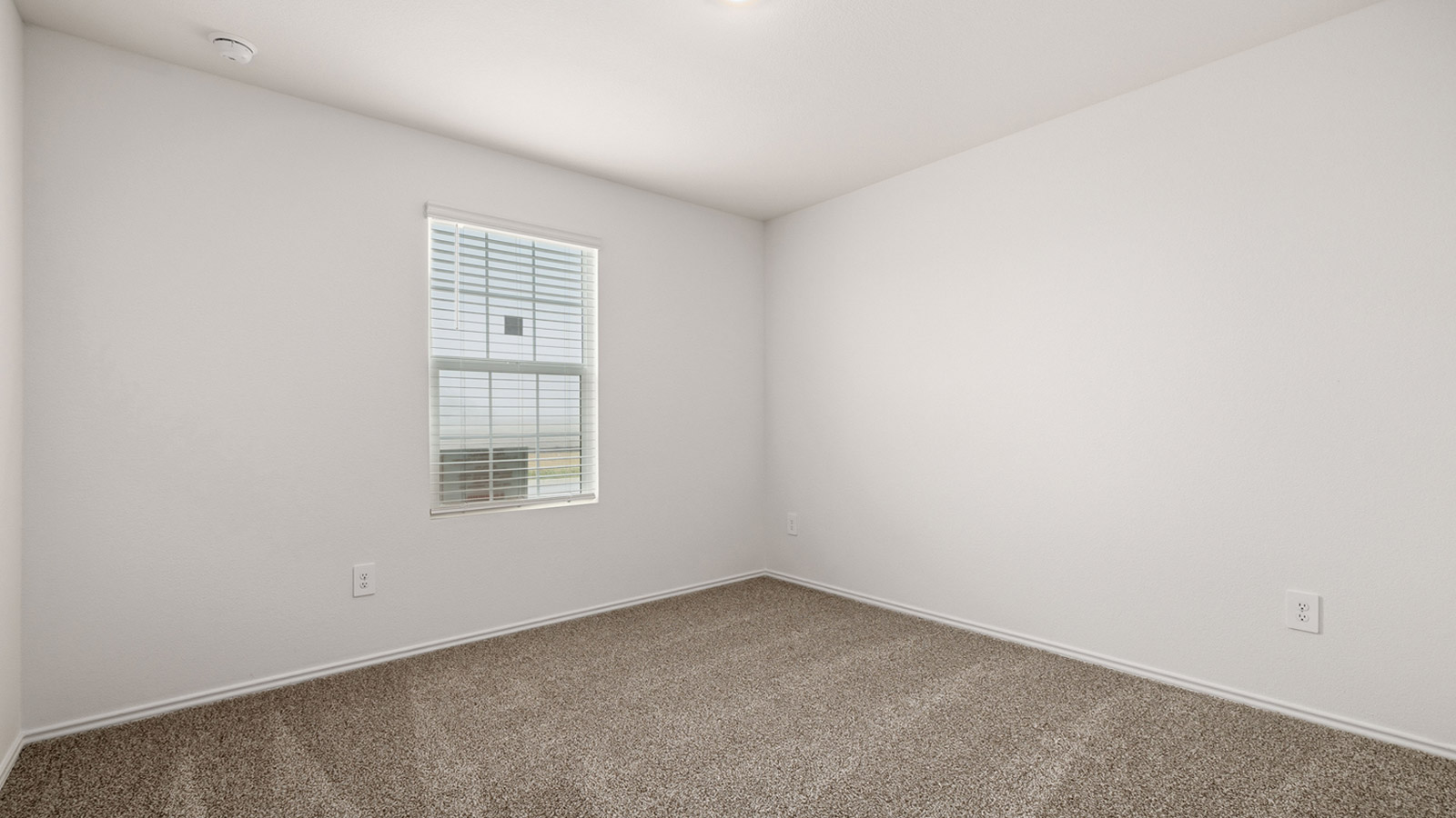 Bedroom 4 with carpeted flooring.