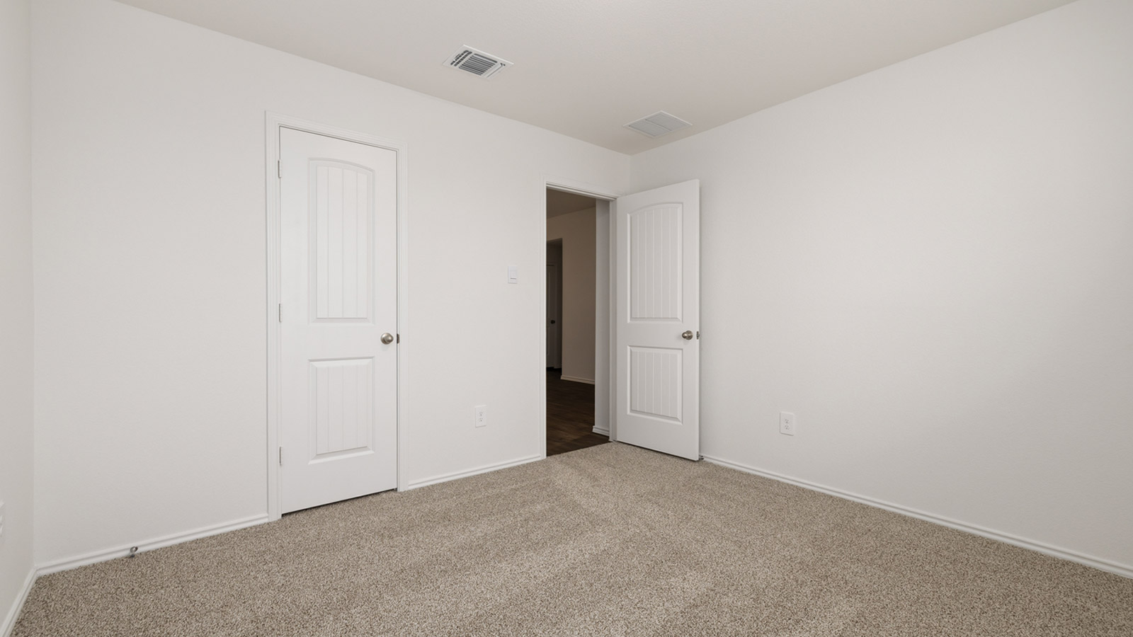 Bedroom 4 with carpeted flooring.