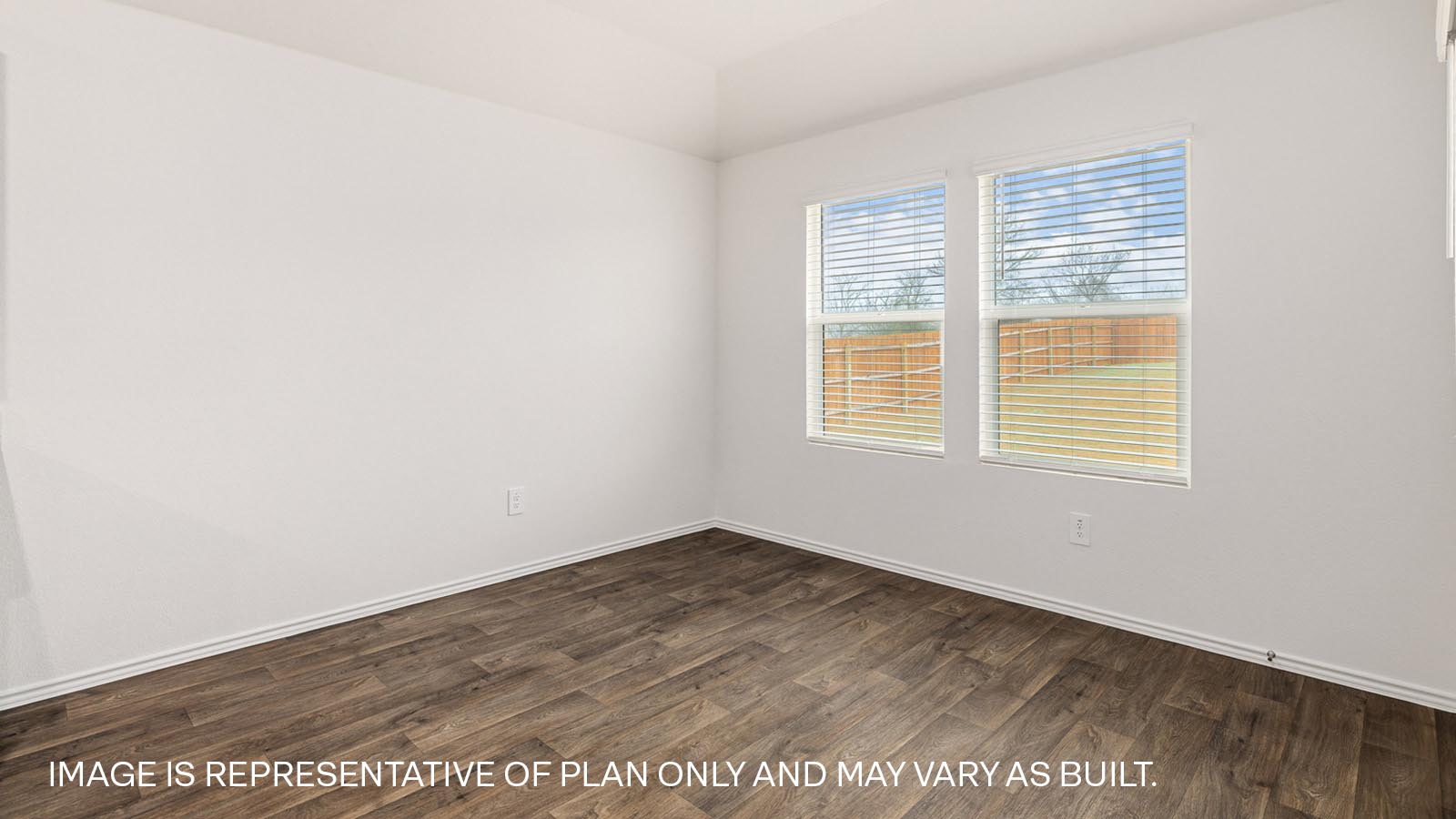 Dining area with window and view of backyard.