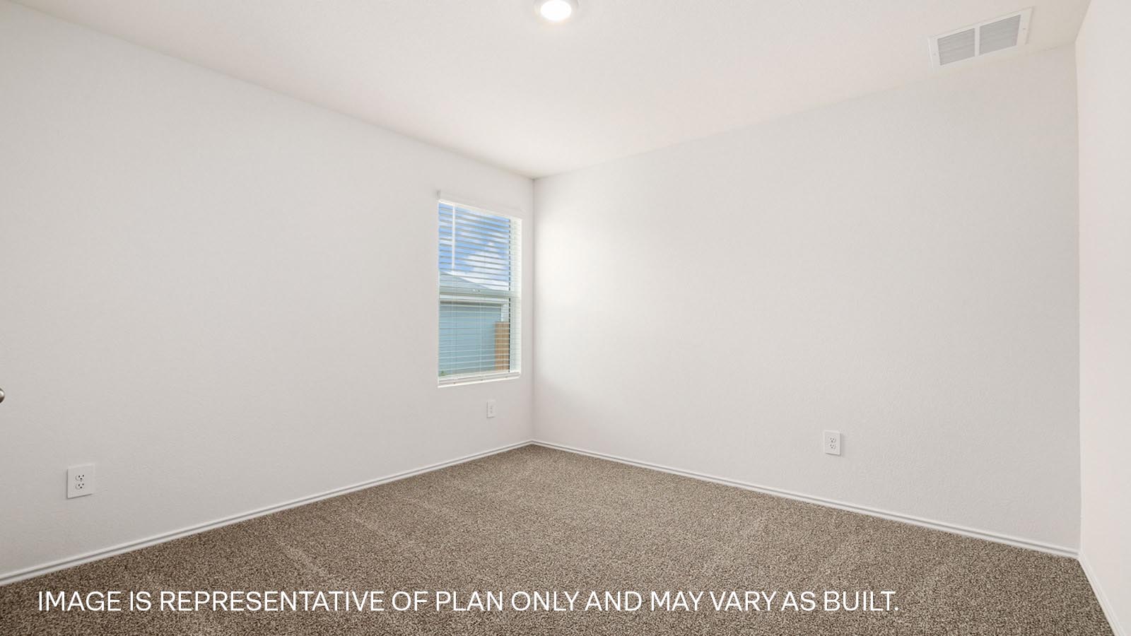 Bedroom 3 with carpeted flooring and window.