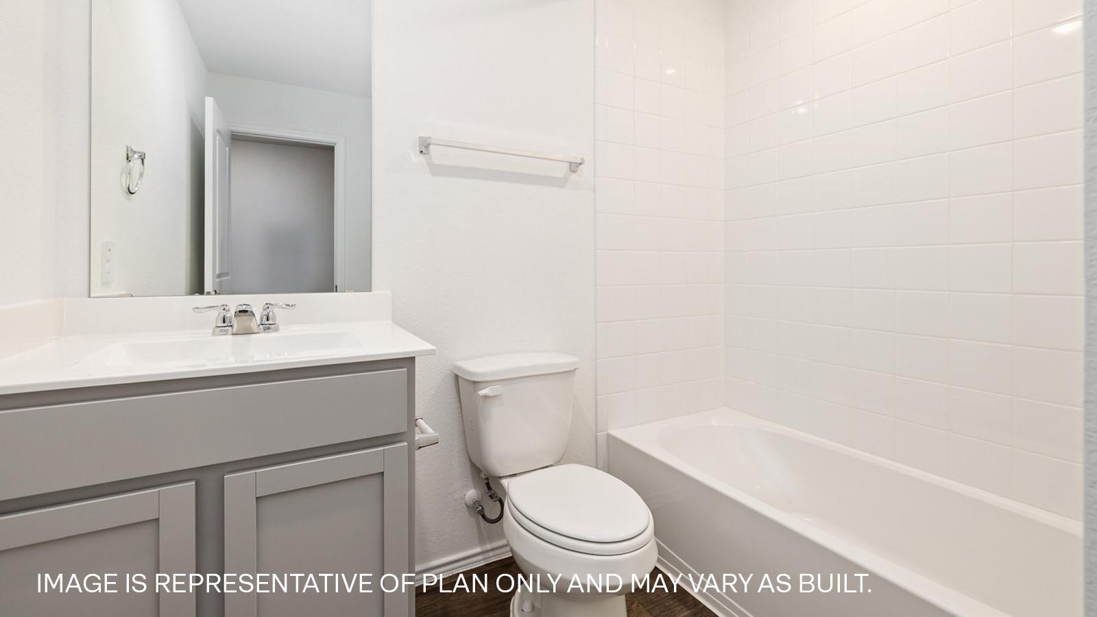 Bathroom 2 with tub and raised shower head.