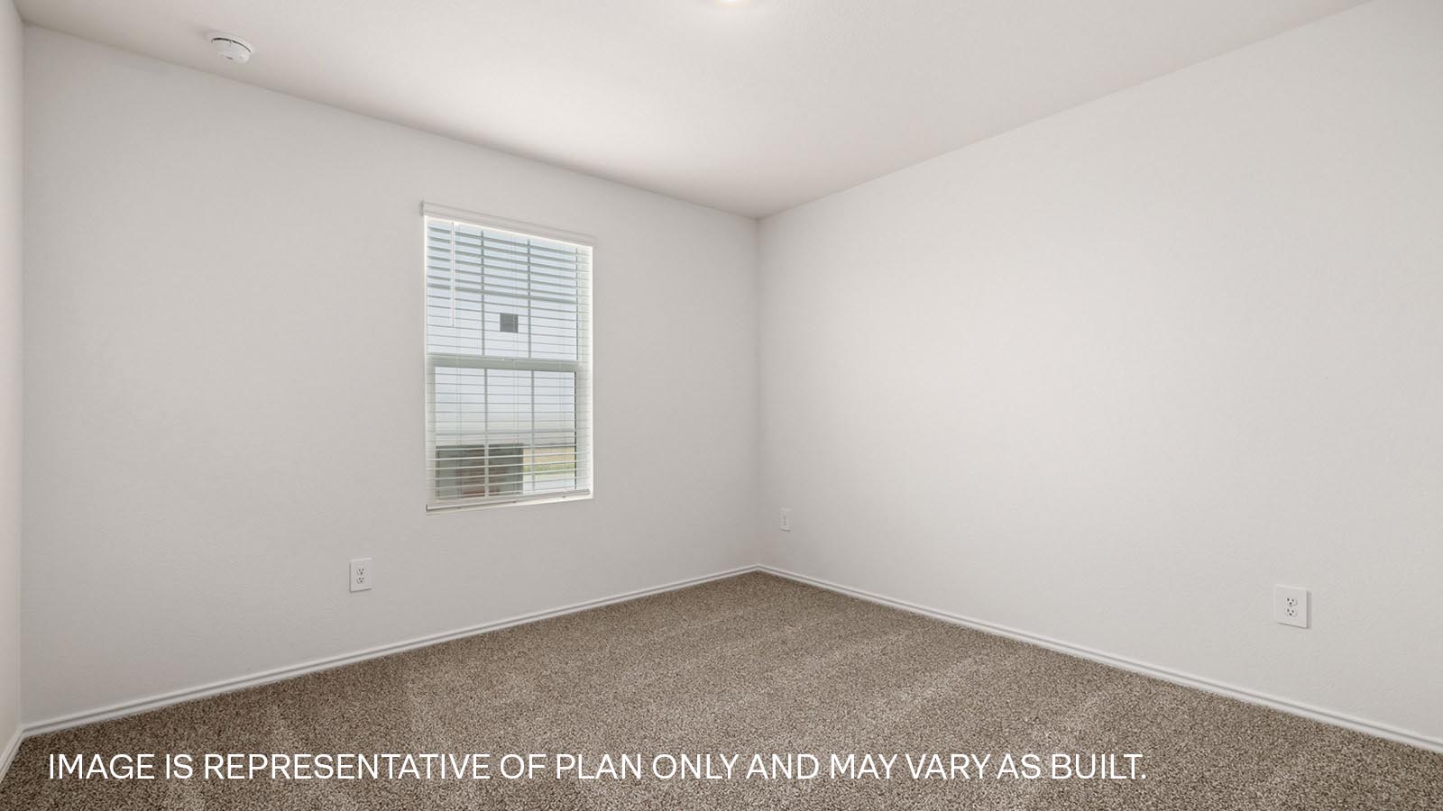 Bedroom 4 with carpeted flooring and window.