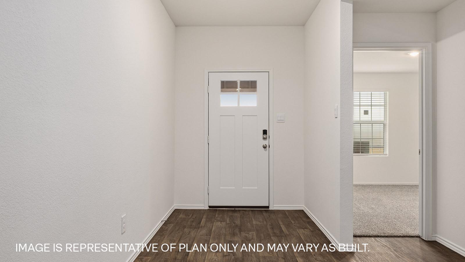 Entryway with vinyl flooring.