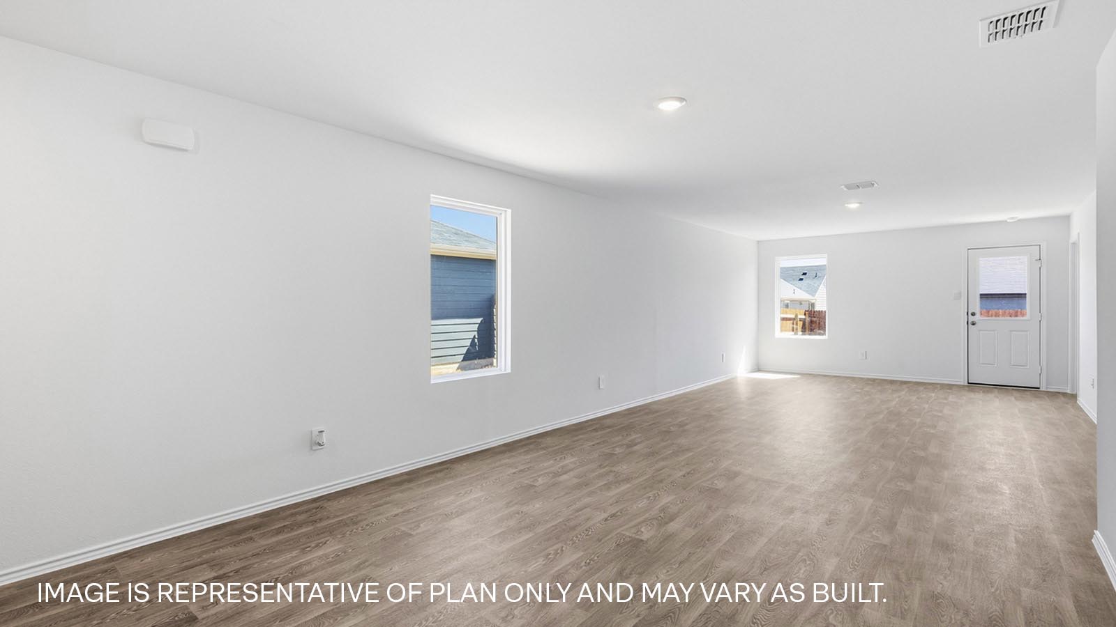 Open concept living area with laminate flooring.