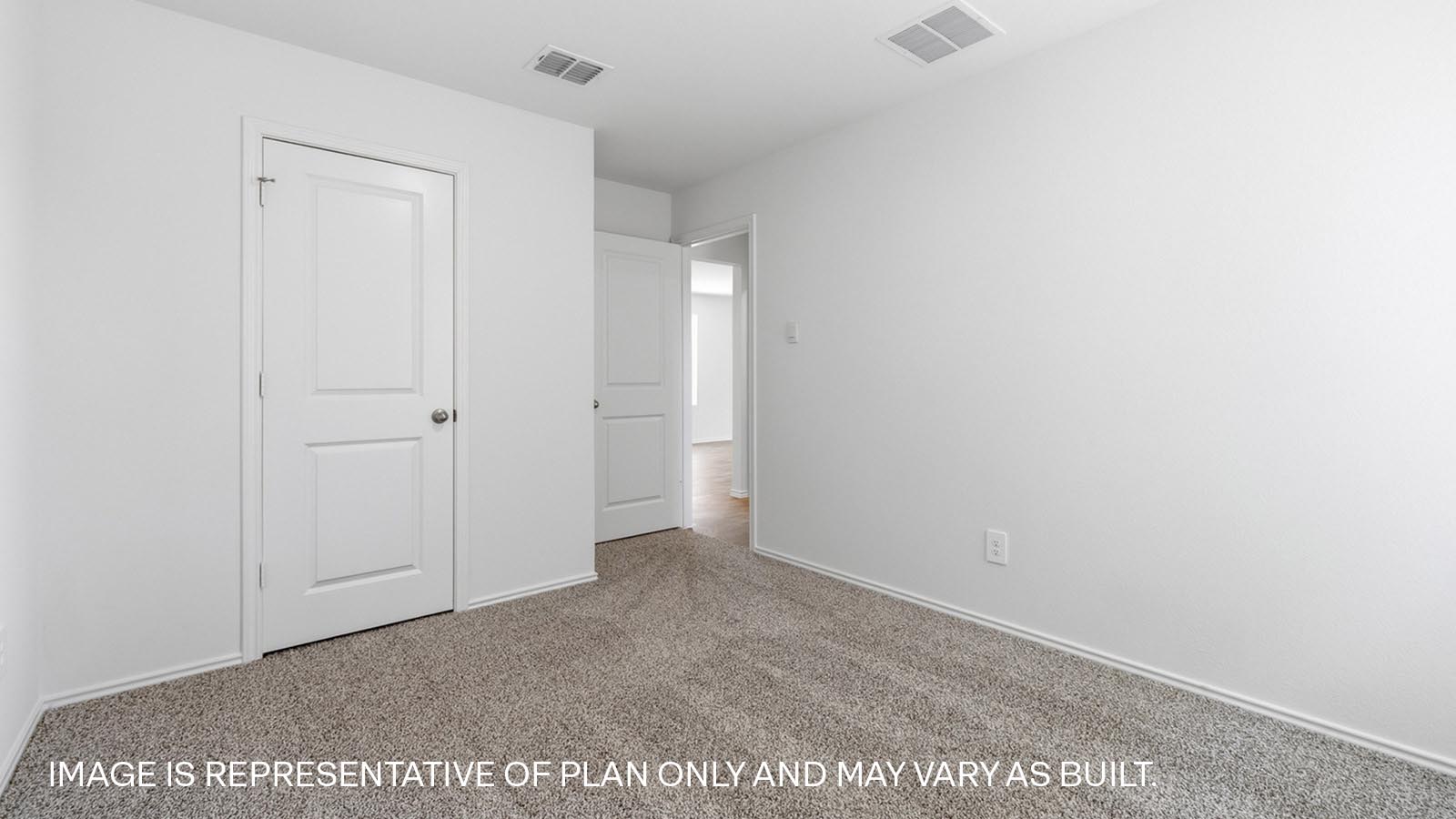 Bedroom 3 with carpeted flooring.