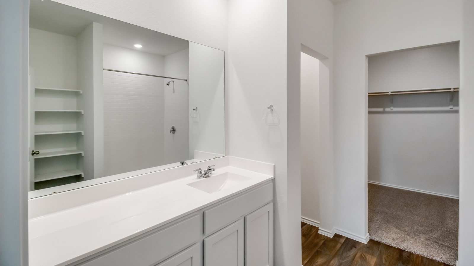 Bathroom 1 with single vanity sink an walk-in shower,