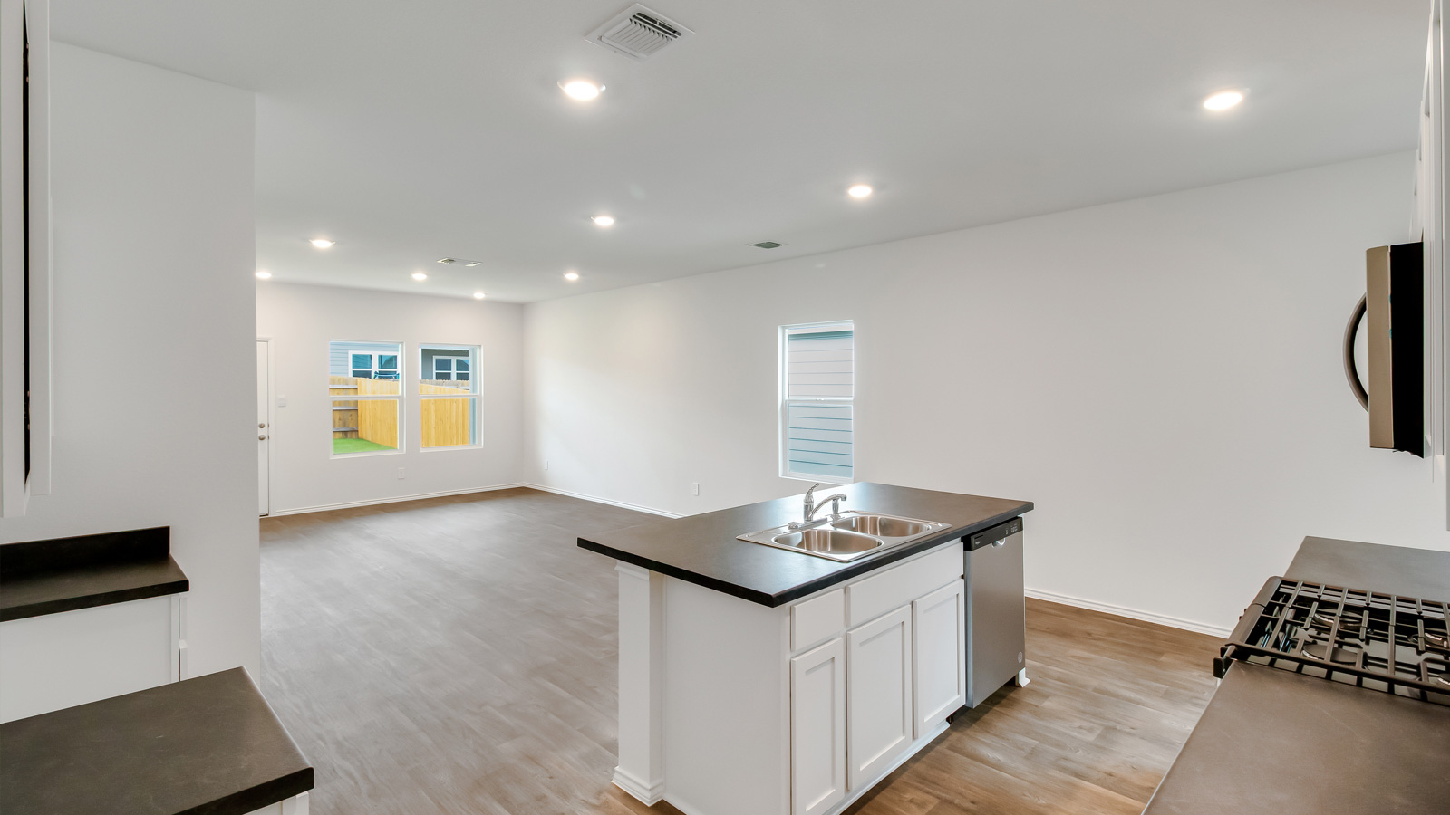 Modern kitchen with stainless steel appliances.