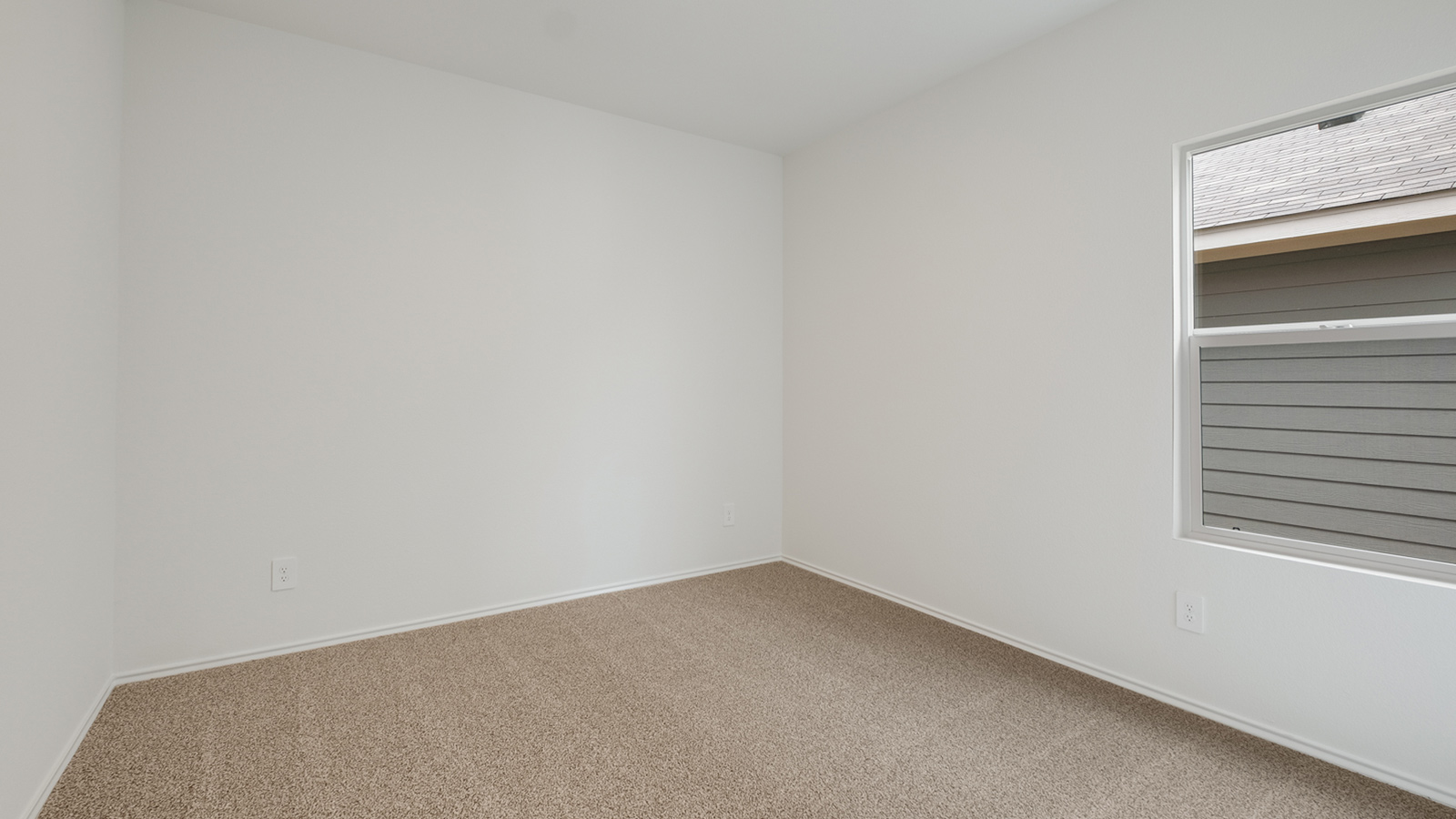 Bedroom 2 located off the entryway.