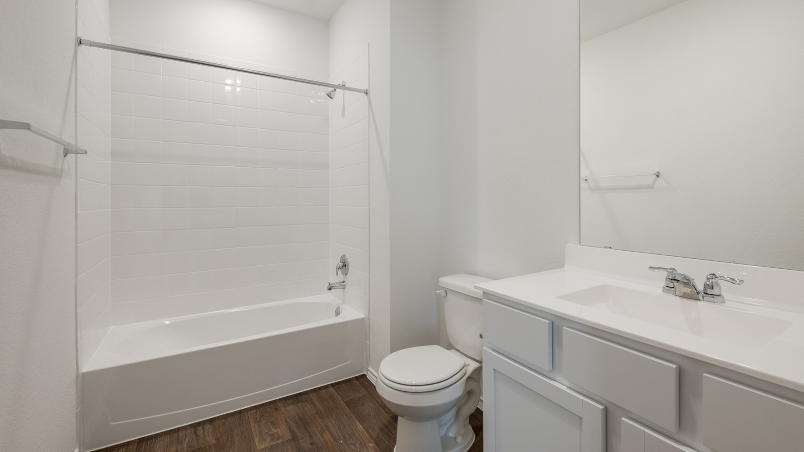 Secondary bathroom located off the entryway with bathtub.