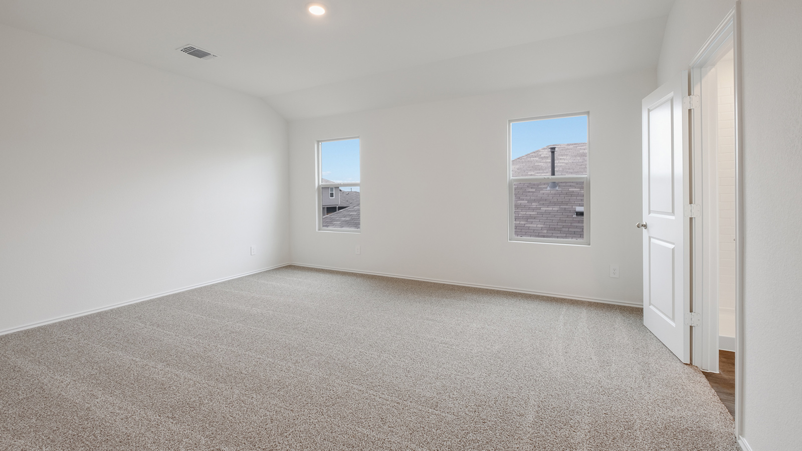 Primary bedroom with adjoined ensuite.