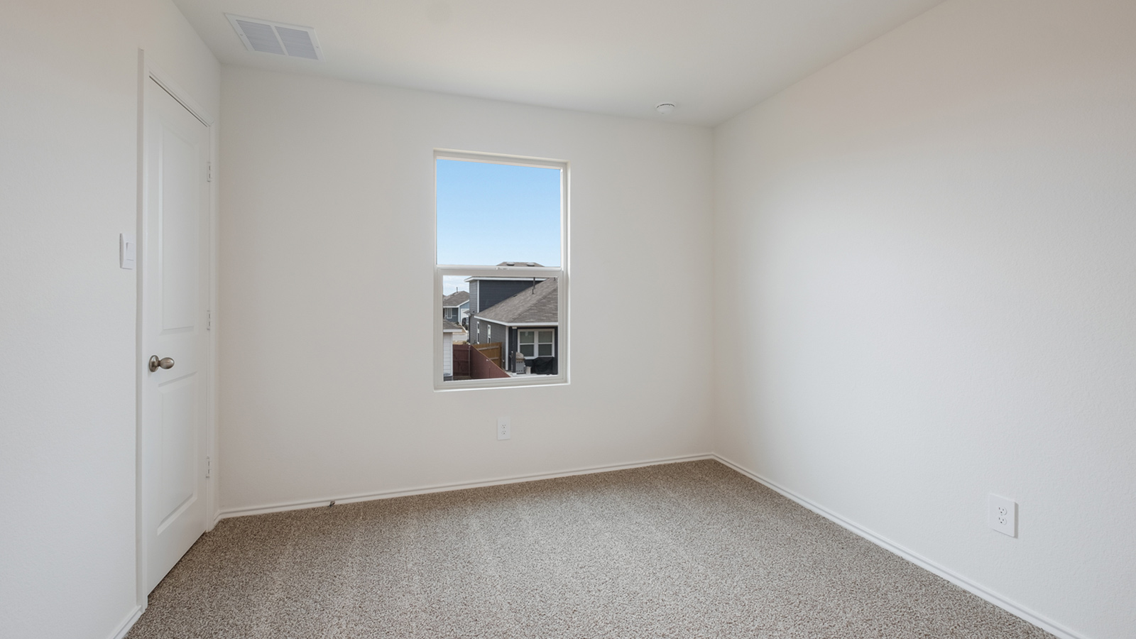 Bedroom 4 with carpeted flooring and window.