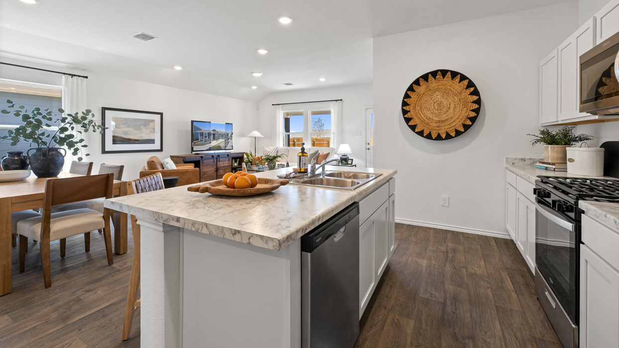 X35C The Caden Foorplan gourmet kitchen with stainless steel appliances