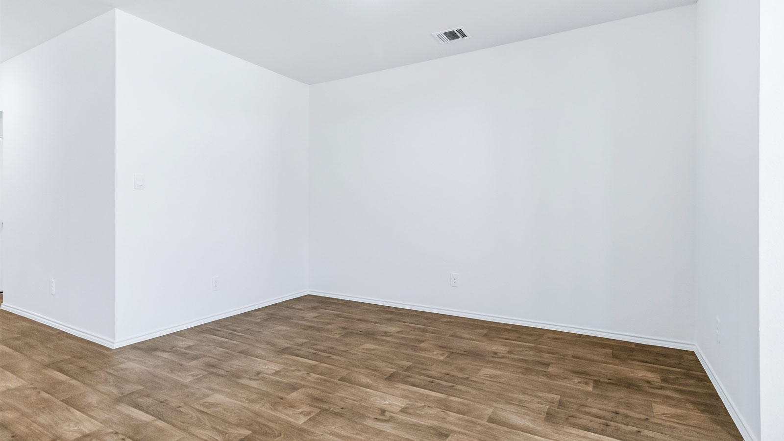 Dining room with natural light, open outdoor access and seamless flow continuing to front foyer and kitchen access