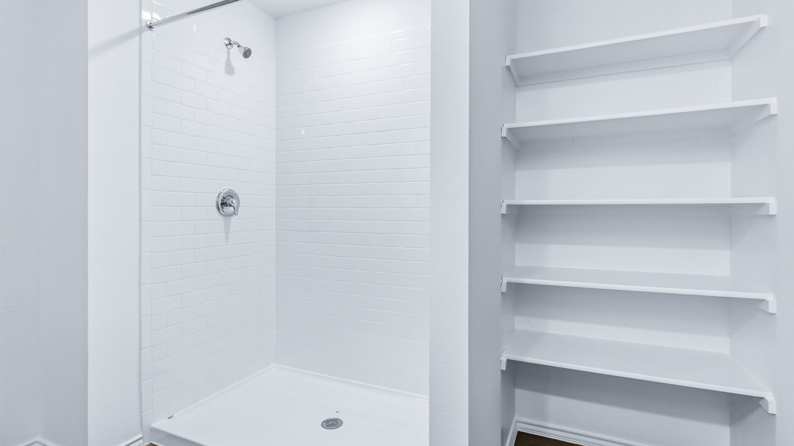 Owner’s en suite adds stylish appeal, spa-inspired design, and access to the primary bedroom and walk-in shower