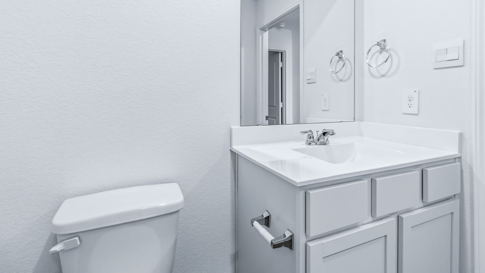 Family full bathroom 2, cabinets, vanity, mirror, tub-shower combo stylishly designed D.R. Horton new home