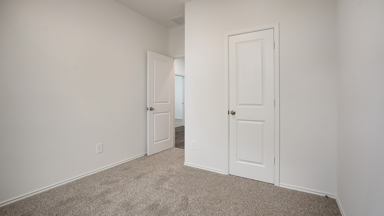 Bedroom 2 with carpeted floors.