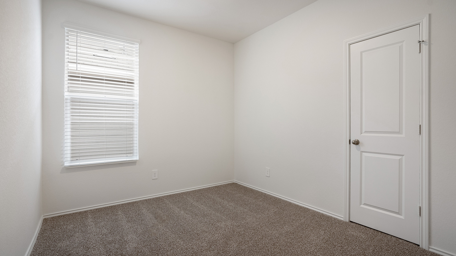 Bedroom 3 with carpeted floors.