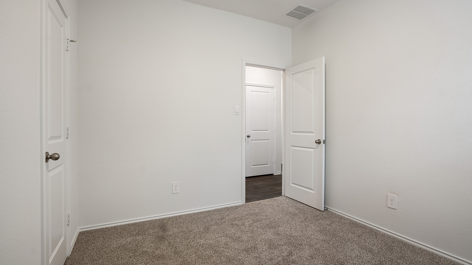 Bedroom 3 with carpeted floors.
