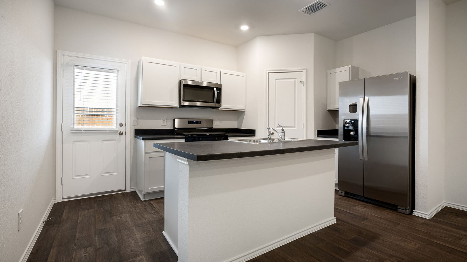 Kitchen with stainless steel appliances.