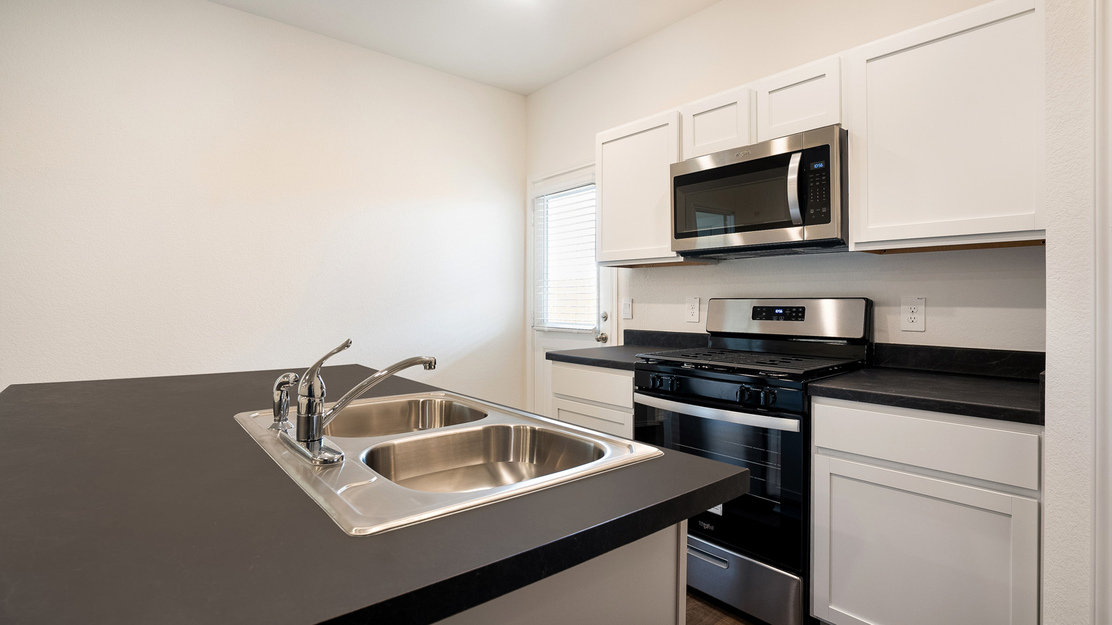 Kitchen with stainless steel appliances.