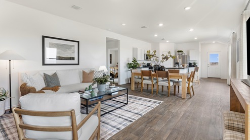 Open concept first floor living area with the living room, dining room and kitchen all flowing seamlessly into eachother