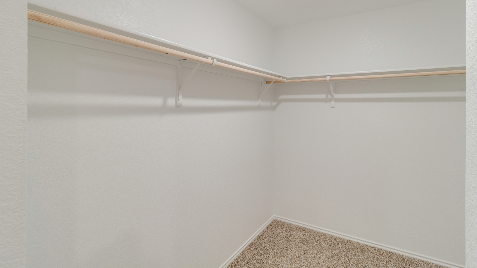 Walk-in closet directly off the primary suite in Wayside designed for modern living
