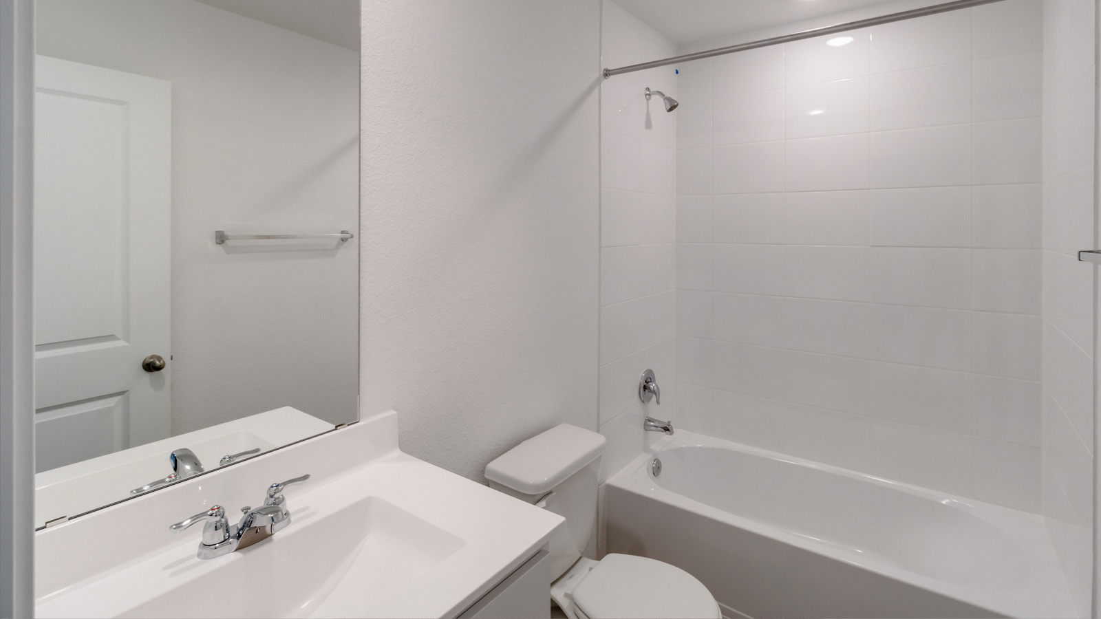 Secondary bathroom with combination shower and tub and horizontal privacy window at Wayside