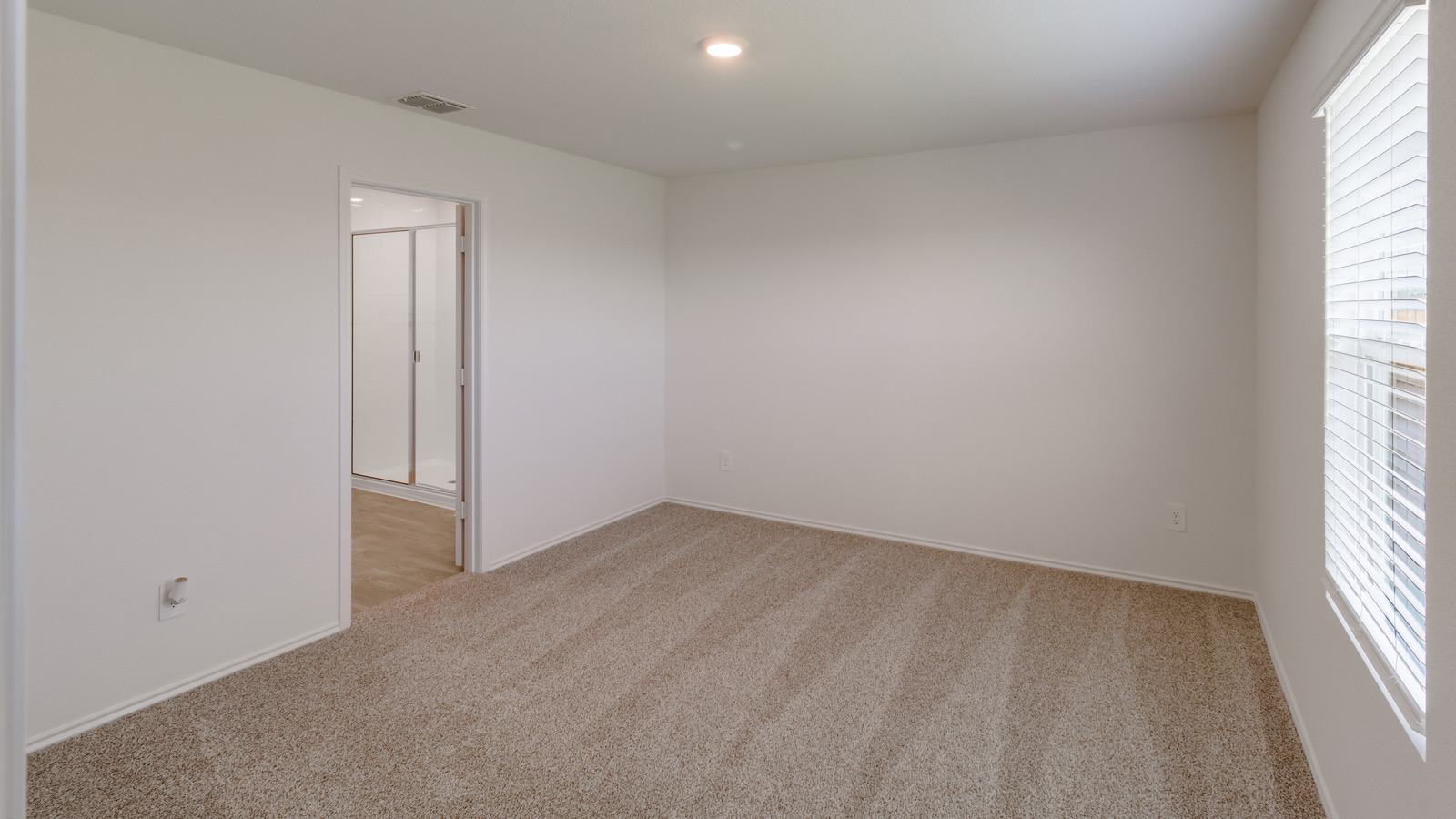 Primary suite includes separation from other bedrooms, in this modern-designed floor plan with ensuite and walk-in closet