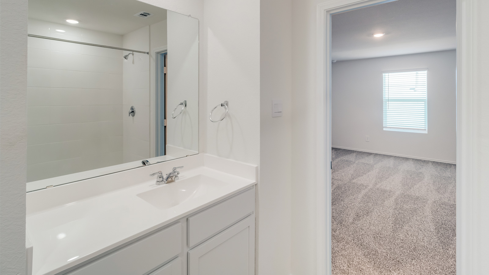 Owner’s en-suite new build home offers a functional layout with upgrades, a walk-in closet, and spa-like en-suite shower-bath designs