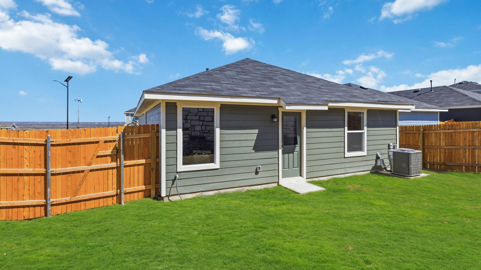 Exterior and backyard of house.